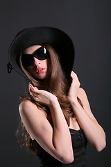 Image showing young woman in the black hat