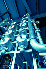 Image showing Pipes, tubes, machinery and steam turbine at a power plant