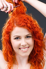 Image showing redhead with scissors