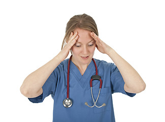 Image showing Preoccupied and tired young nurse