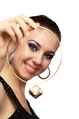 Image showing Happy girl with golden heart shaped necklace in her hand