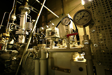 Image showing Pipes, tubes, machinery and steam turbine at a power plant