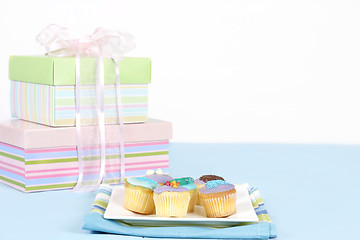 Image showing Little cakes sitting on a white plate