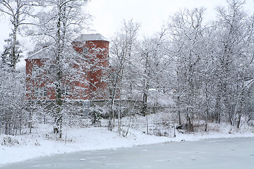 Image showing winter landscape with red house