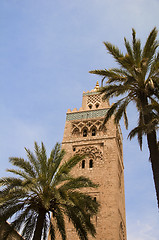 Image showing koutubia mosque minaret with palm trees in koutubia gardens marr