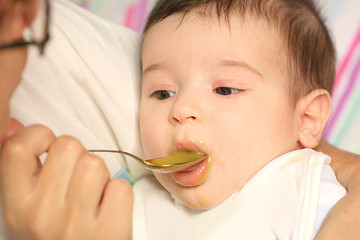 Image showing small child eats