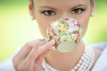 Image showing girl drink coffee