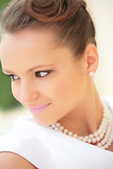 Image showing smiling girl with pearl necklace