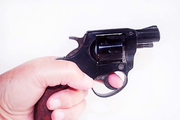 Image showing Hand holding gun