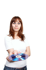 Image showing Young beautiful woman holding a cd.