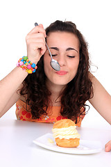 Image showing Young girl eating cake