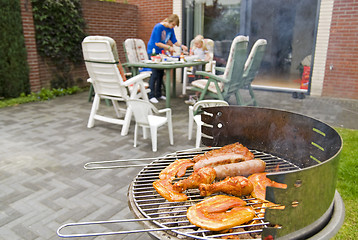 Image showing Meat and kebabs on barbecue.