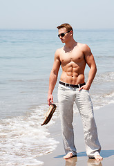 Image showing Handsome man standing on beach