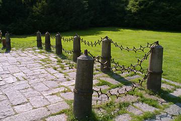 Image showing Metal fence with stone columns