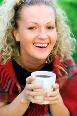 Image showing woman holding a cup