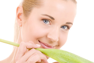 Image showing happy woman with green leaf