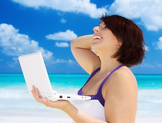 Image showing woman with laptop computer on the beach
