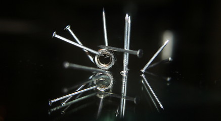 Image showing nut and nails