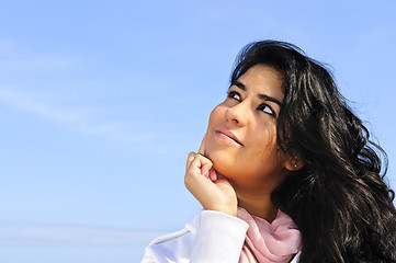 Image showing Beautiful young woman looking up