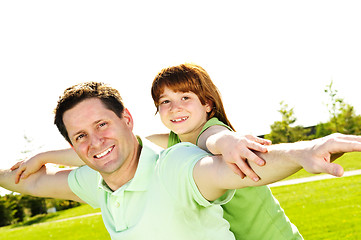 Image showing Father and daughter piggyback