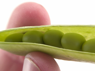 Image showing Holding peas