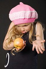 Image showing surprised girl with apple