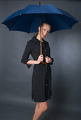 Image showing young woman with umbrella