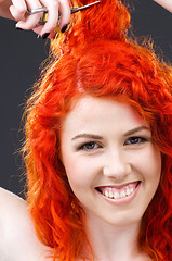 Image showing redhead with scissors