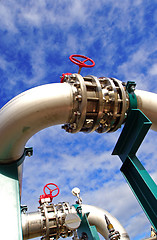 Image showing Pipes, bolts, valves against blue sky