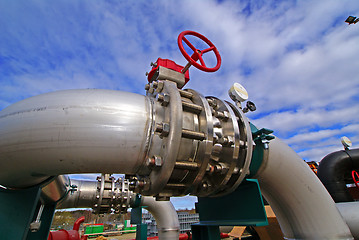 Image showing Pipes, bolts, valves against blue sky