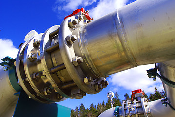 Image showing Pipes, bolts, valves against blue sky