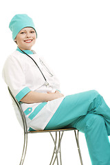 Image showing Smiling doctor sitting on chair