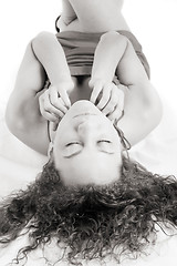 Image showing dreamy girl lying on a floor