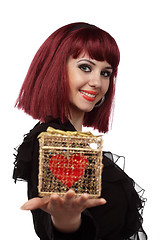 Image showing Beautiful woman with heart packed in a golden gift box