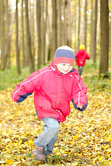 Image showing Boy running in forest