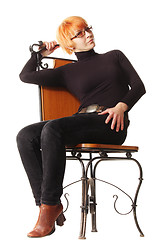 Image showing Woman and wooden chair