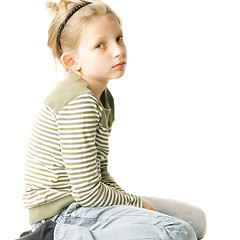 Image showing Girl sitting on white ground