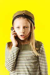 Image showing Little girl talking by phone