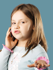 Image showing Little girl talking mobile