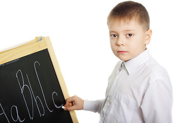 Image showing Schoolboy at blackboard