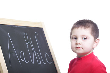Image showing Little boy at blackboard