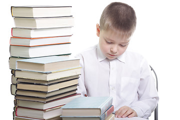 Image showing Writing at table in books surrounding