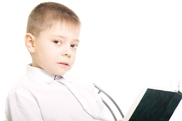 Image showing Boy reading book sideview