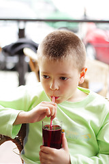 Image showing Boy with cold drink