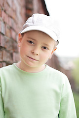 Image showing Boy at brick wall