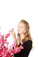 Image showing Girl with pink flowers