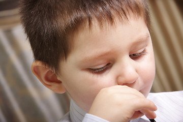 Image showing Boy drinking juice close-up