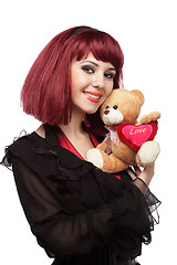 Image showing Happy girl with Teddy bear with heart in her hands