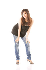 Image showing Girl in jeans bending