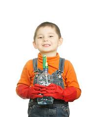 Image showing Smiling boy with spray